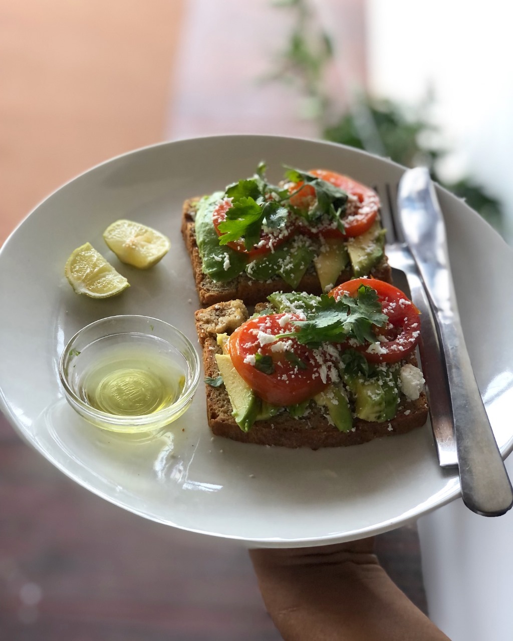Avocado toast with tomato and cilantro
