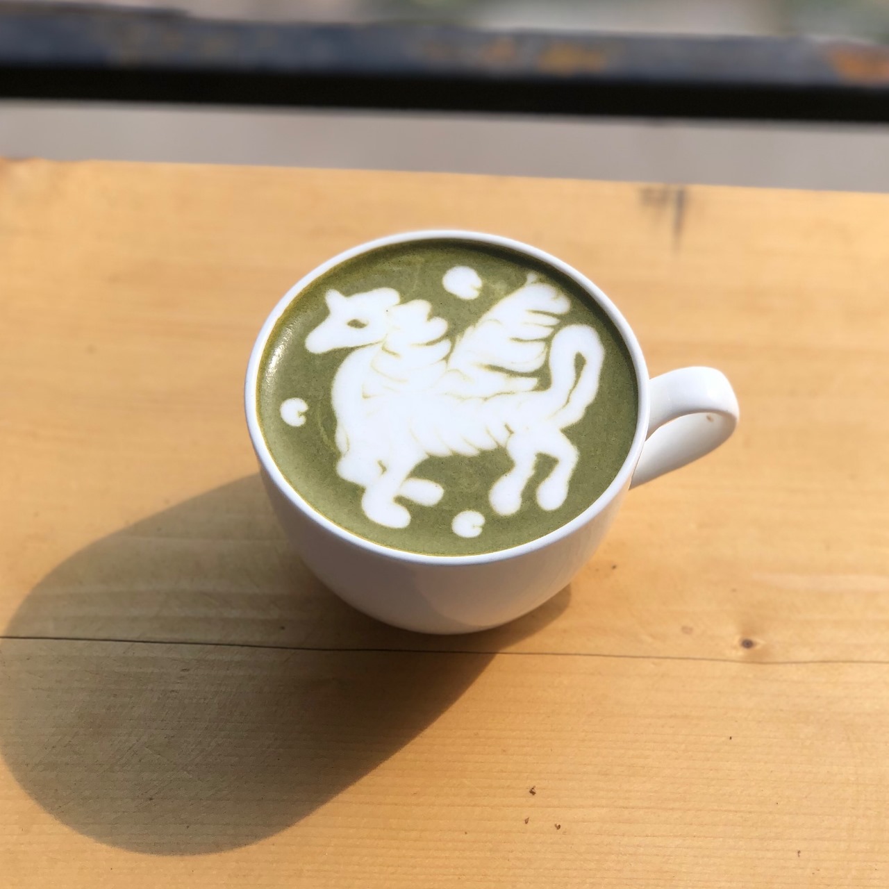 Matcha latte with pegasus art