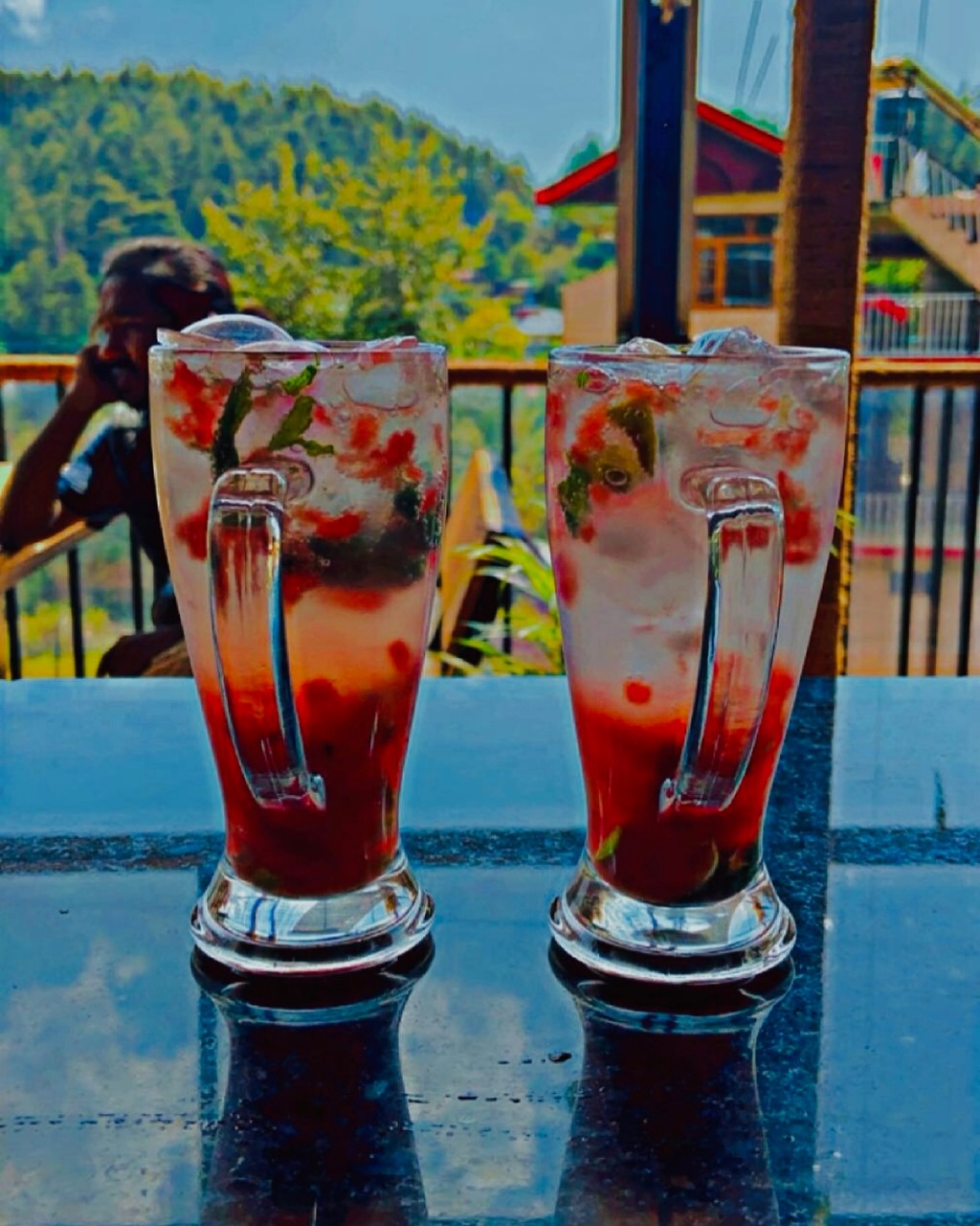 Strawberry mojitos with mountain view